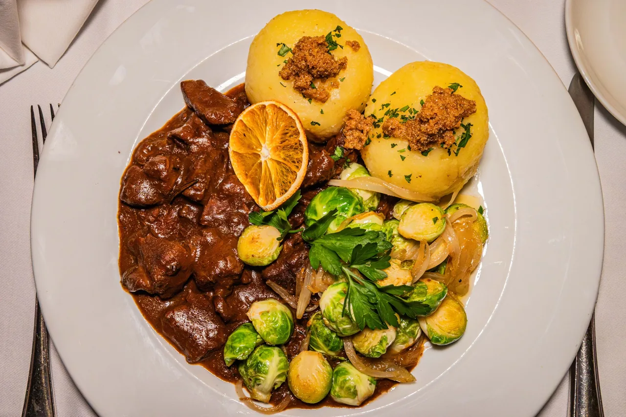 Thuringian dumplings with braised beef and Brussels sprouts at Restaurant Nüsslein Erfurt
